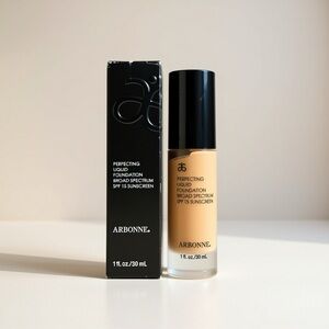 Arbonne Liquid Foundation in Black and Cream Golden Beige